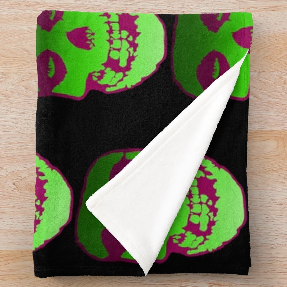 Misfit-inspired plush blanket featuring a skull design