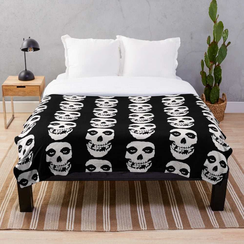 Misfits-inspired plush blanket with skull and logo design