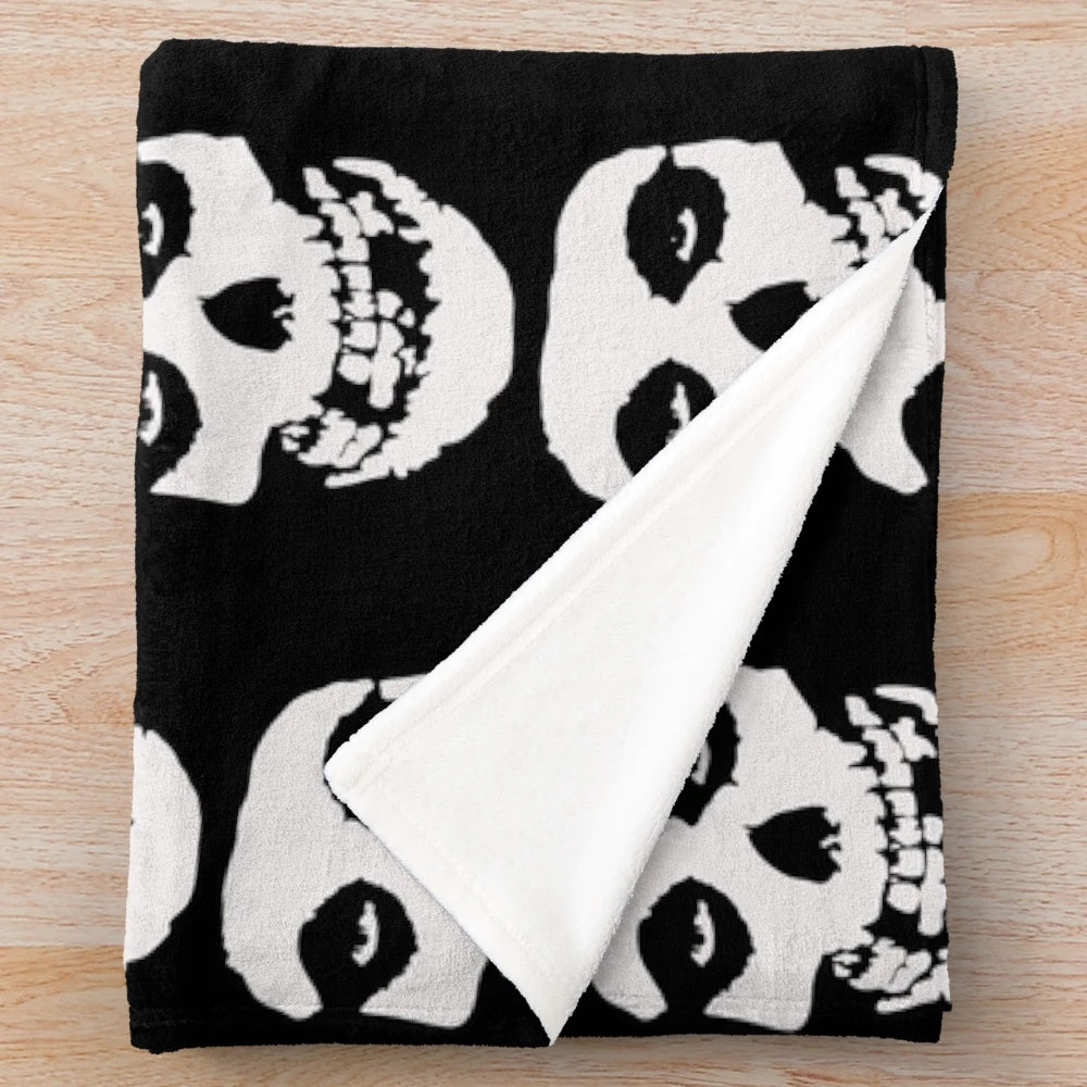 Misfits-inspired plush blanket with skull and logo design