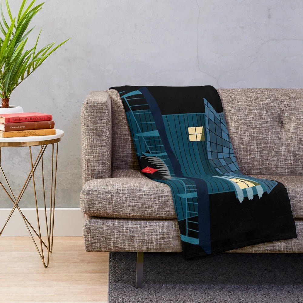 Plush blanket featuring a spooky monster house under the moonlight