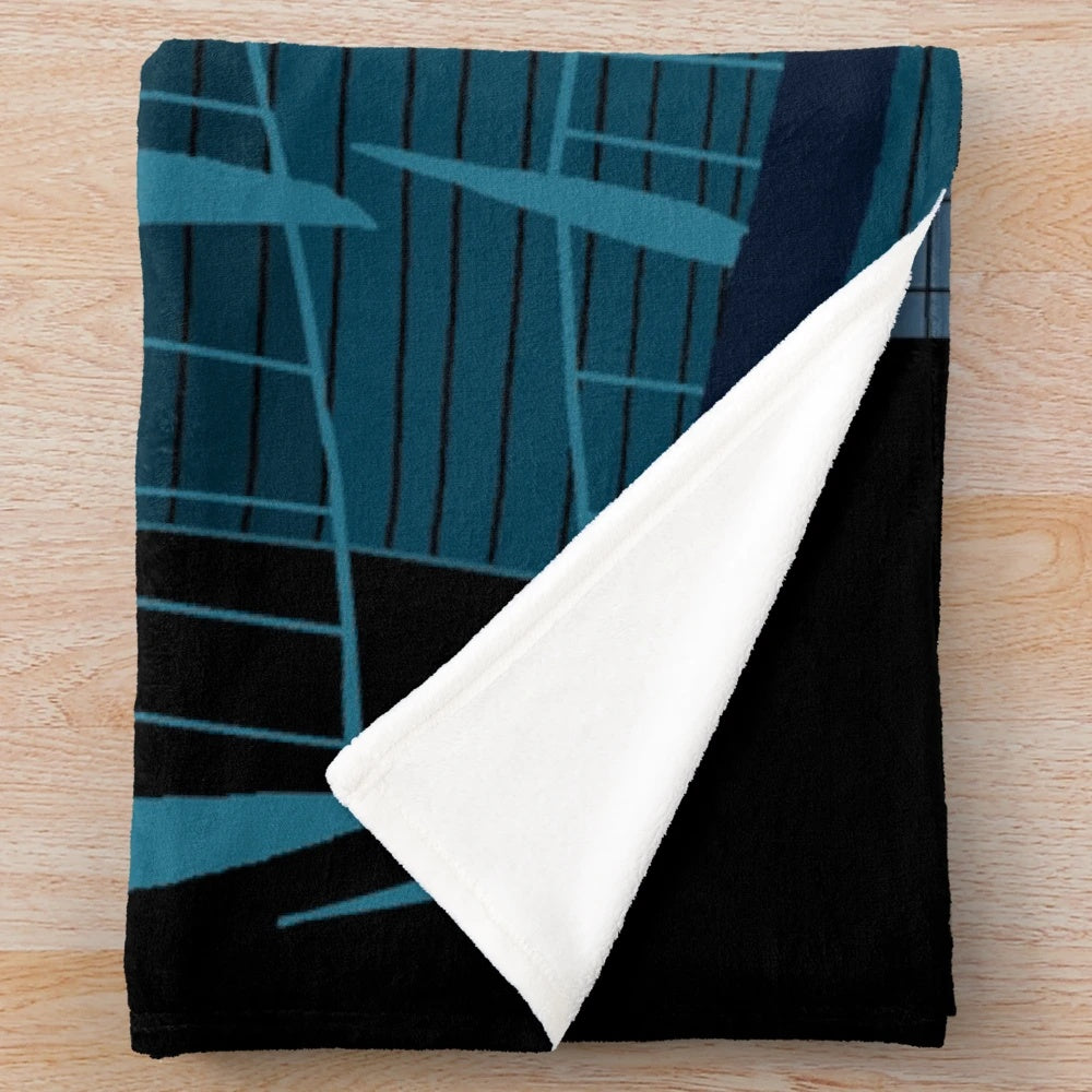 Plush blanket featuring a spooky monster house under the moonlight
