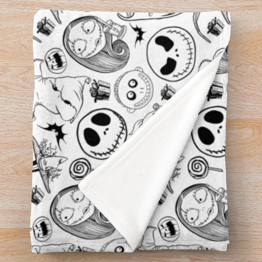 Nightmare Before Christmas themed plush blanket with Jack Skellington, Sally, and other characters