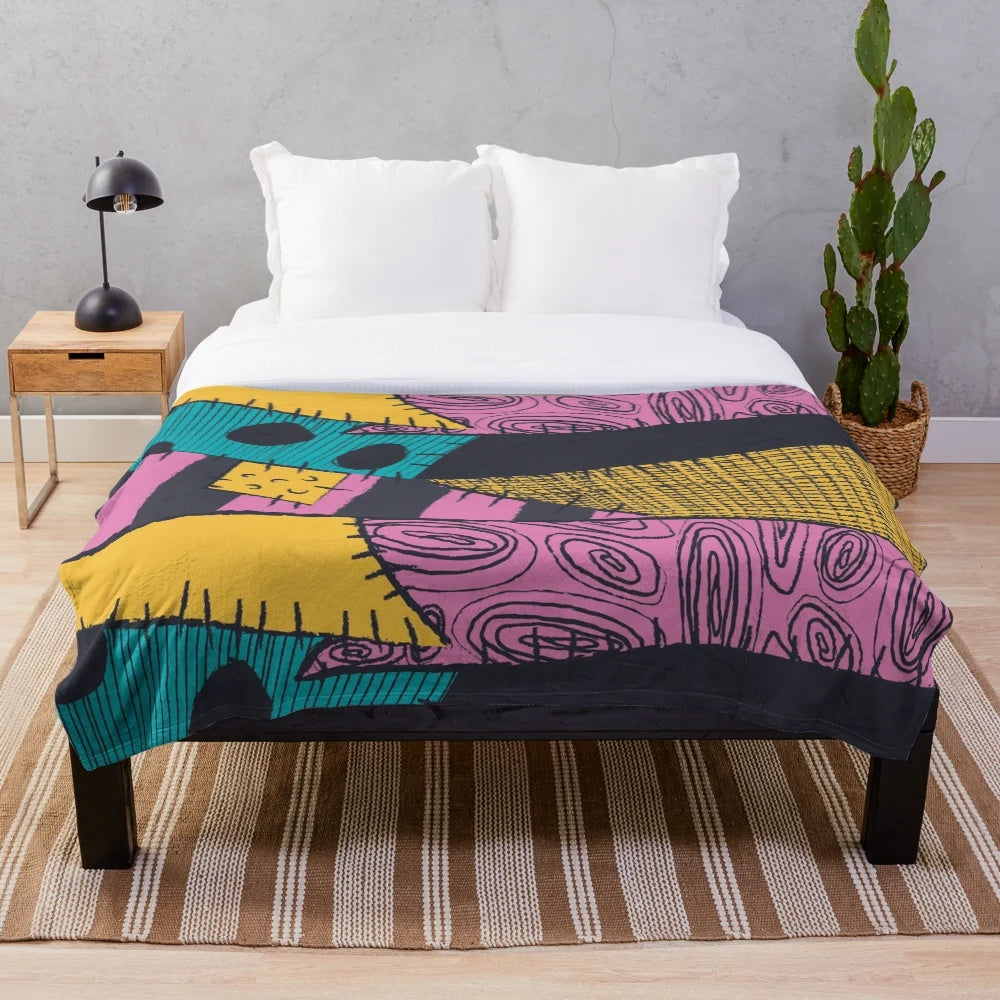 Nightmare-inspired plush blanket with spooky sewn pattern