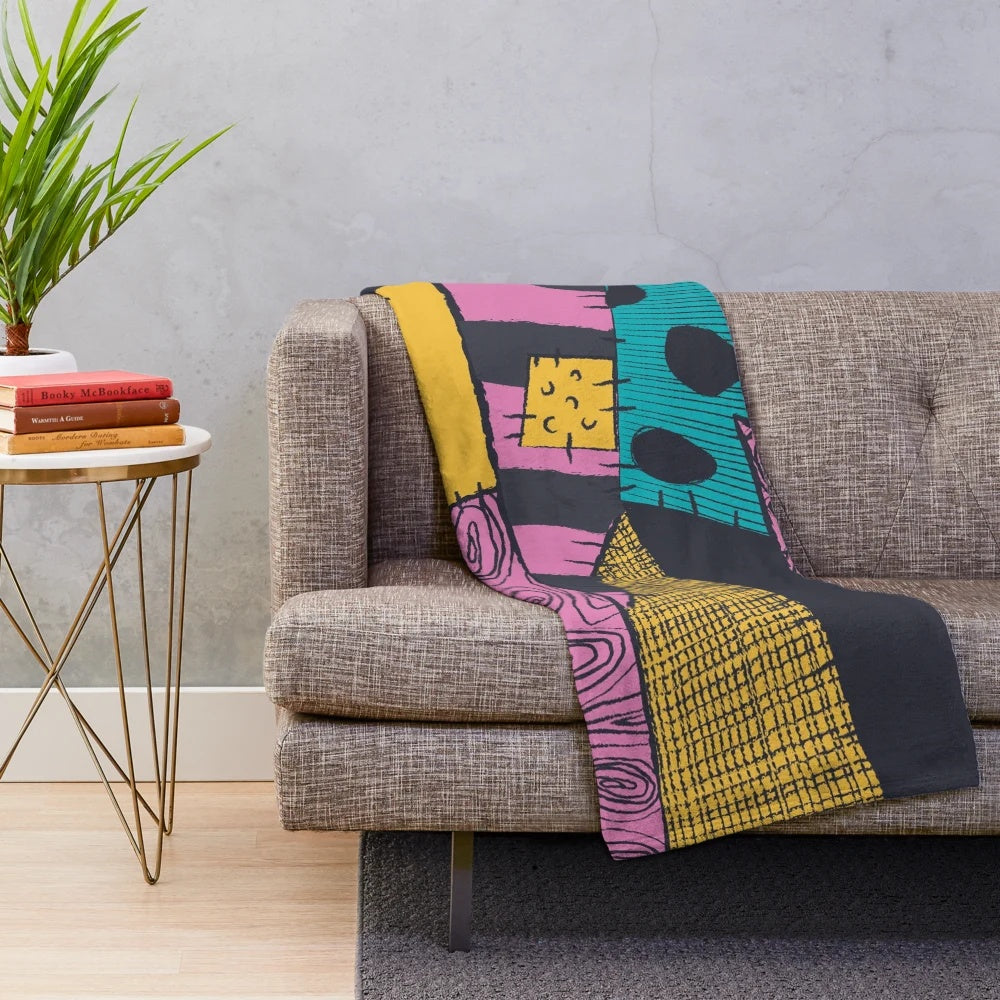 Nightmare-inspired plush blanket with spooky sewn pattern