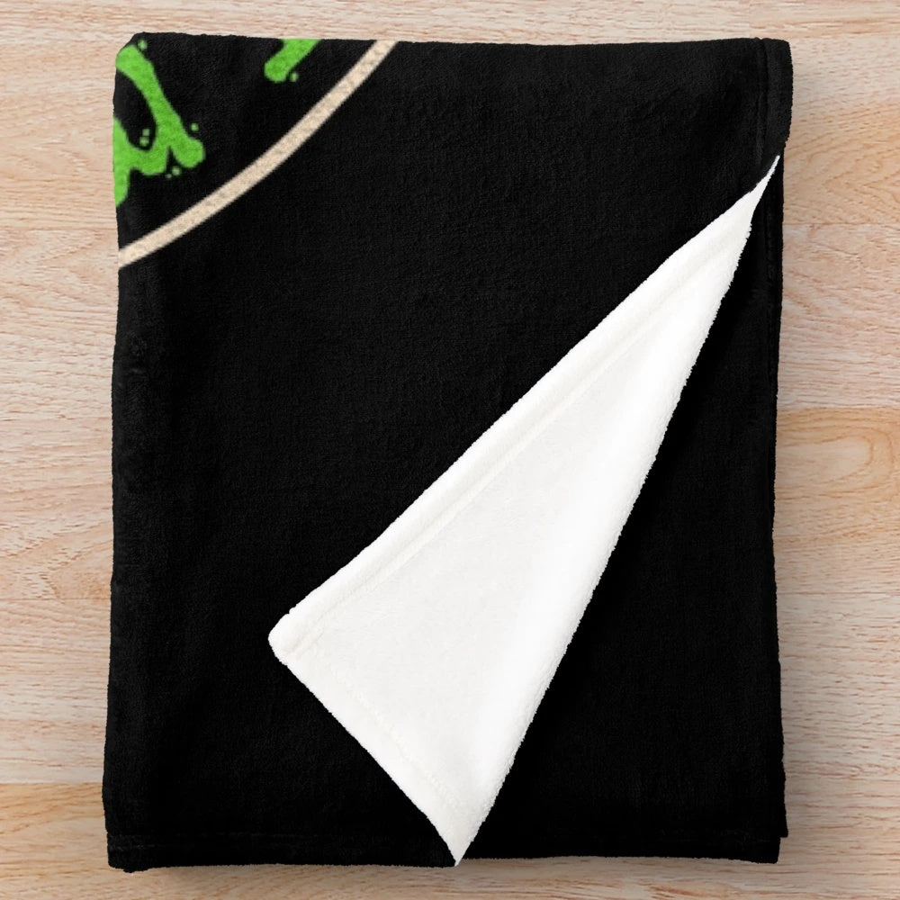Optometrist plush blanket with spooky halloween elements like cats, bats, and spider webs