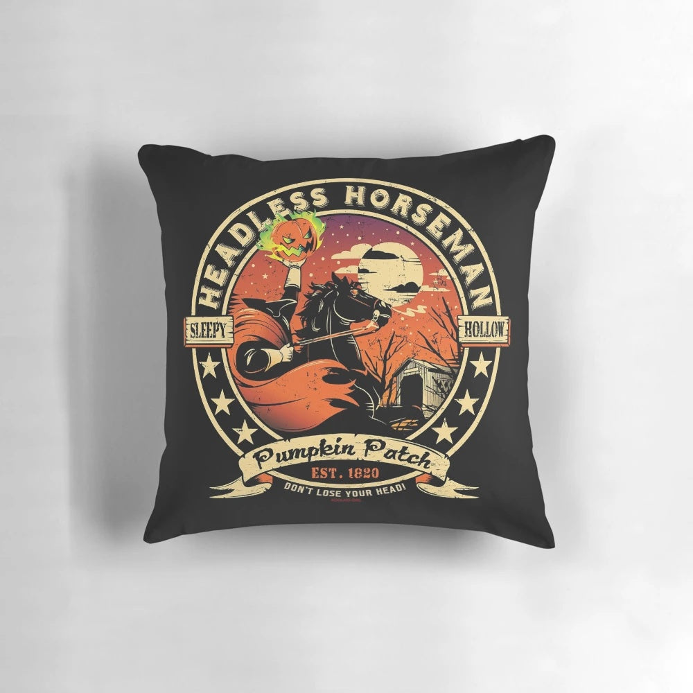 Vintage-inspired pillow featuring a headless horseman logo, perfect for fall and Halloween decor.