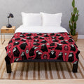 Spooky plague doctor plush blanket with repeating patterns of ravens, leeches, and flowers