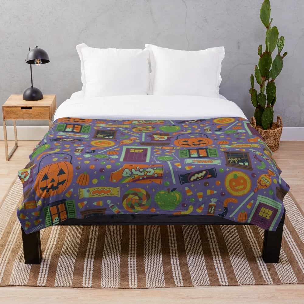 Spooky plush blanket featuring whimsical Halloween designs