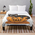 Spooky plush blanket featuring cats, ghosts, and Halloween-themed design