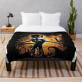 Cozy plush blanket featuring a spooky skeleton and pumpkin design