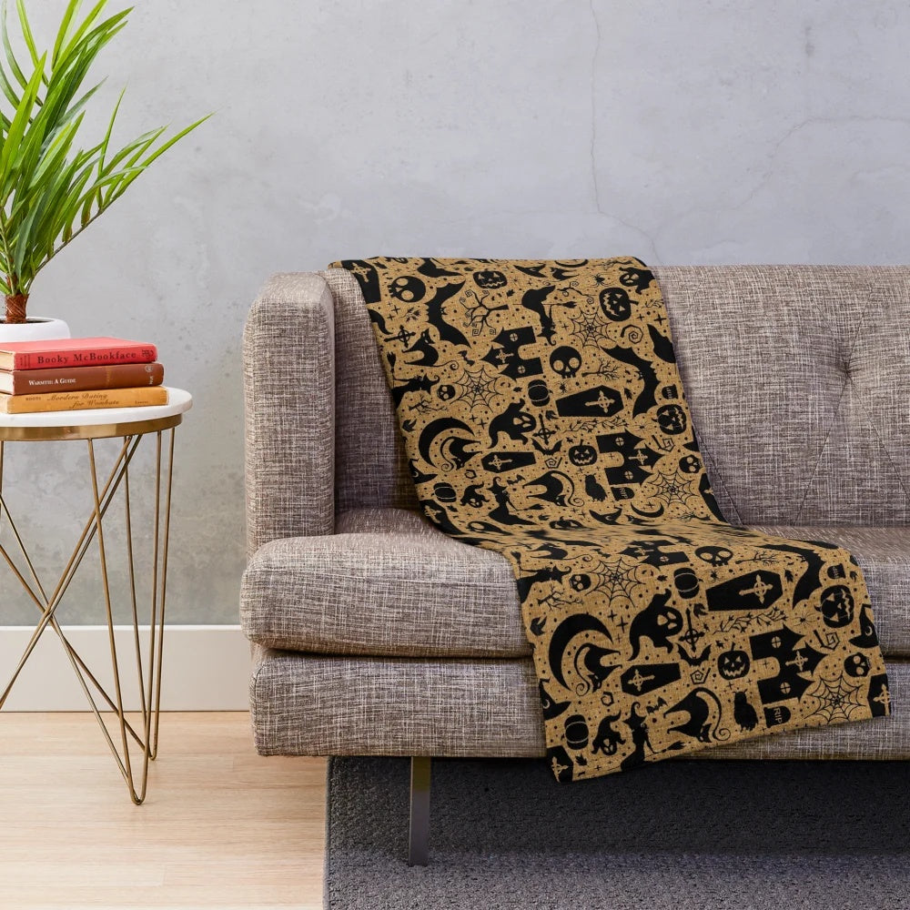Plush Halloween-themed blanket with pumpkin and black pattern