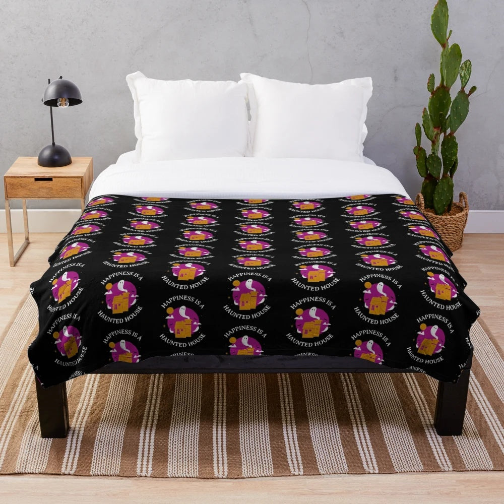 Plush purple Halloween blanket with haunted house design