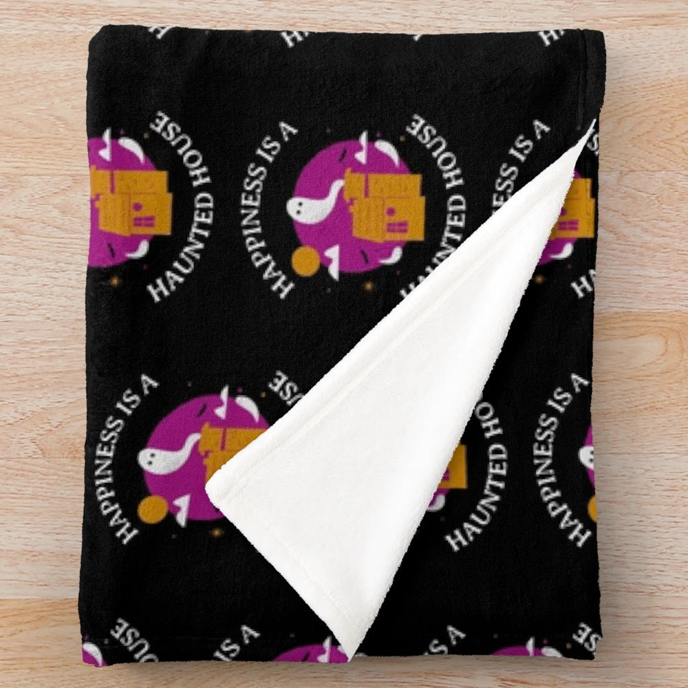 Plush purple Halloween blanket with haunted house design