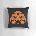 A whimsical pumpkin-shaped cat pillow in black, white, and orange for cozy, festive home decor.
