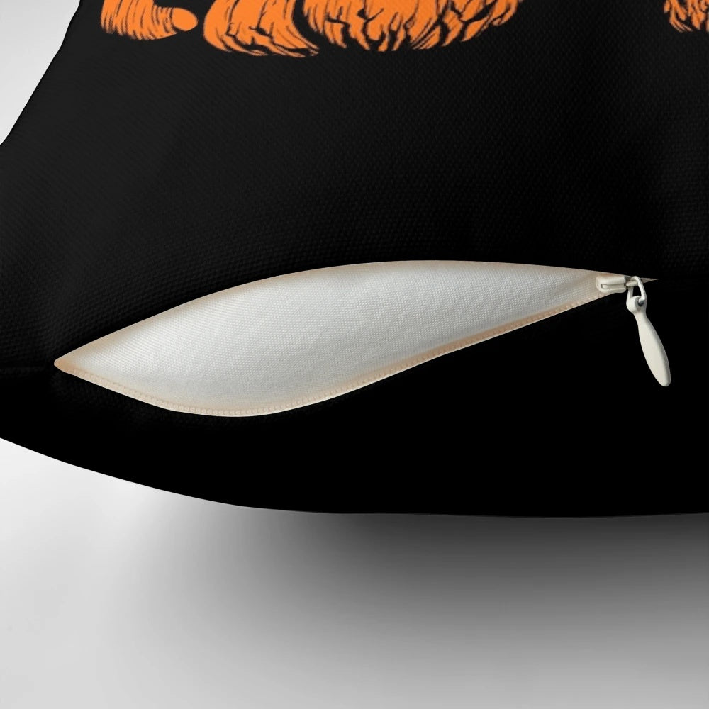 A whimsical pumpkin-shaped cat pillow in black, white, and orange for cozy, festive home decor.