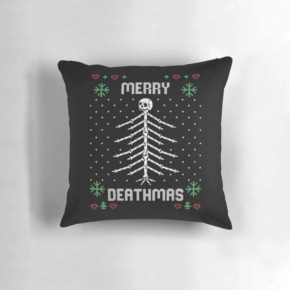 A gothic and punk-inspired Christmas throw pillow featuring a skeletal Christmas tree design.