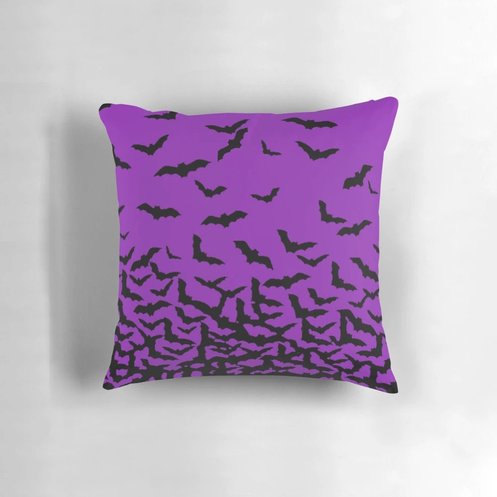 A plush purple bats pillow perfect for Halloween and Gothic home decor.