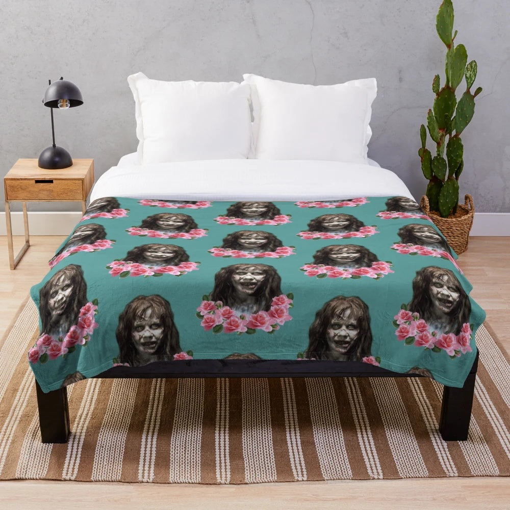 Plush blanket with a horror-themed design, featuring the Reagan character