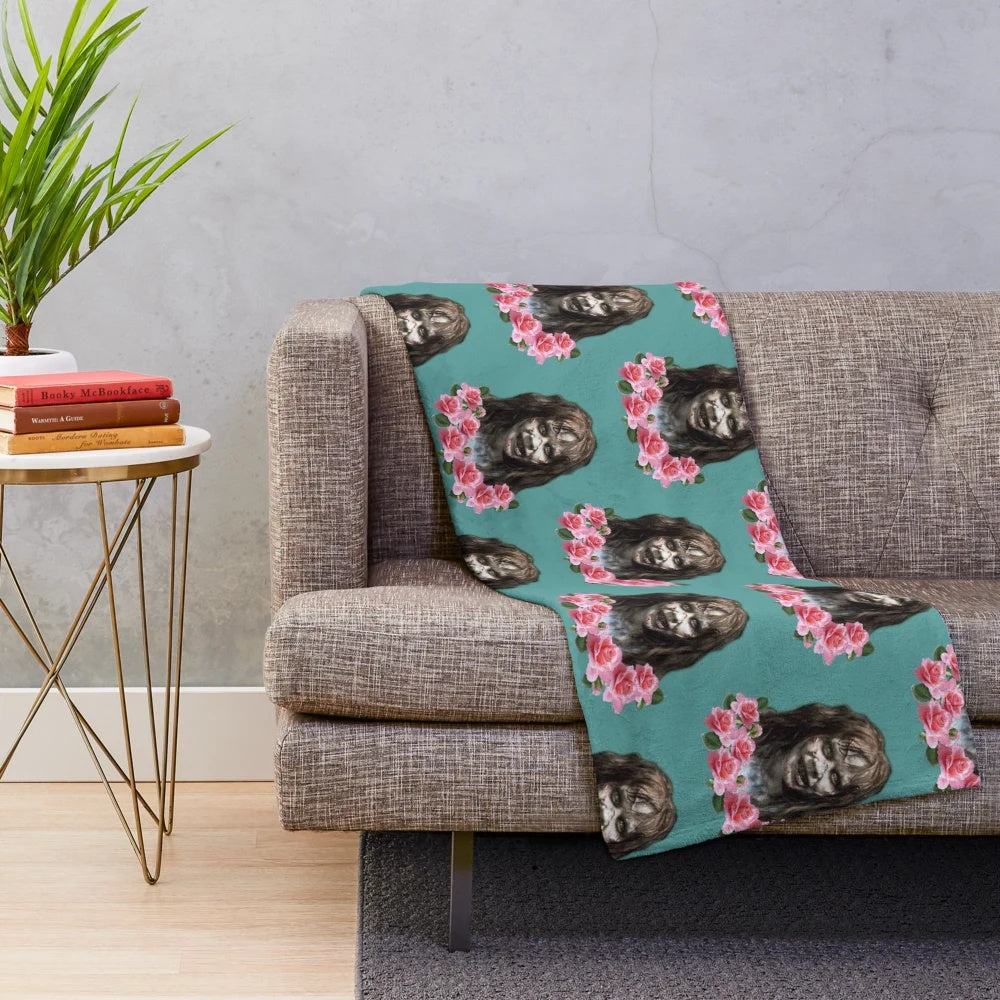 Plush blanket with a horror-themed design, featuring the Reagan character