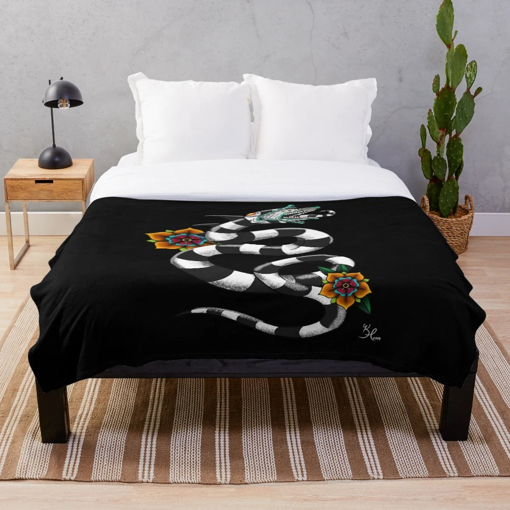 Sandworm plush blanket with a black and white floral design inspired by Tim Burton's iconic creature