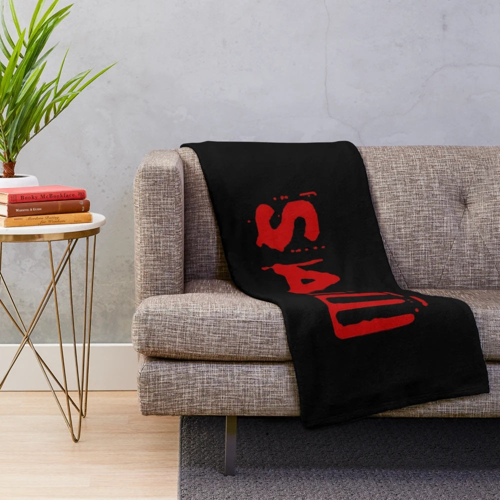 Saw movie logo horror-themed plush blanket
