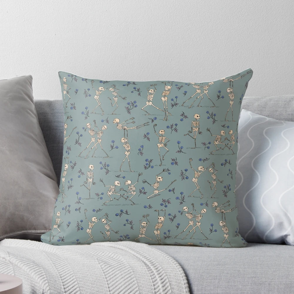 Blue decorative pillow featuring a dancing skeleton design, perfect for Halloween home decor.