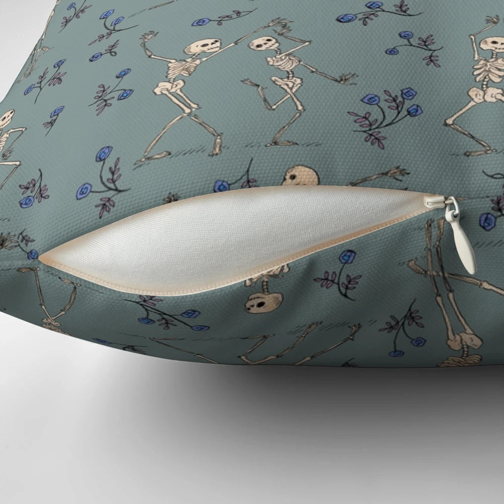 Blue decorative pillow featuring a dancing skeleton design, perfect for Halloween home decor.