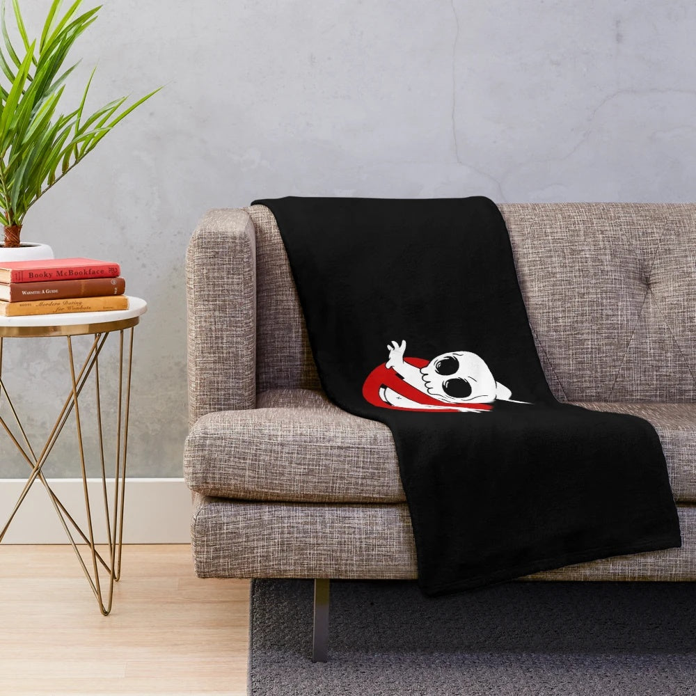 Spooky skull plush blanket featuring ghostbusters-inspired design