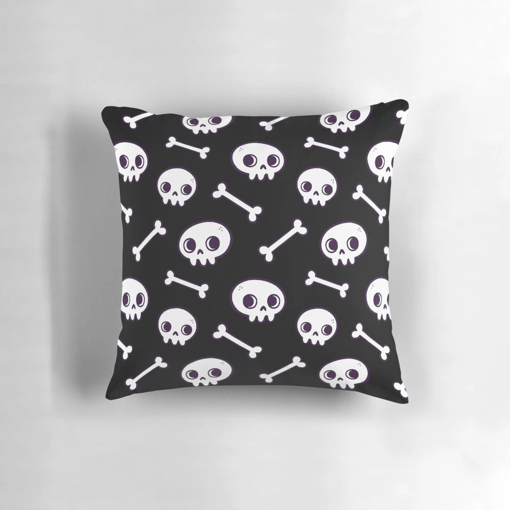 Soft, cozy pillow featuring a repeating pattern of cute, minimalist skulls in shades of black and white.