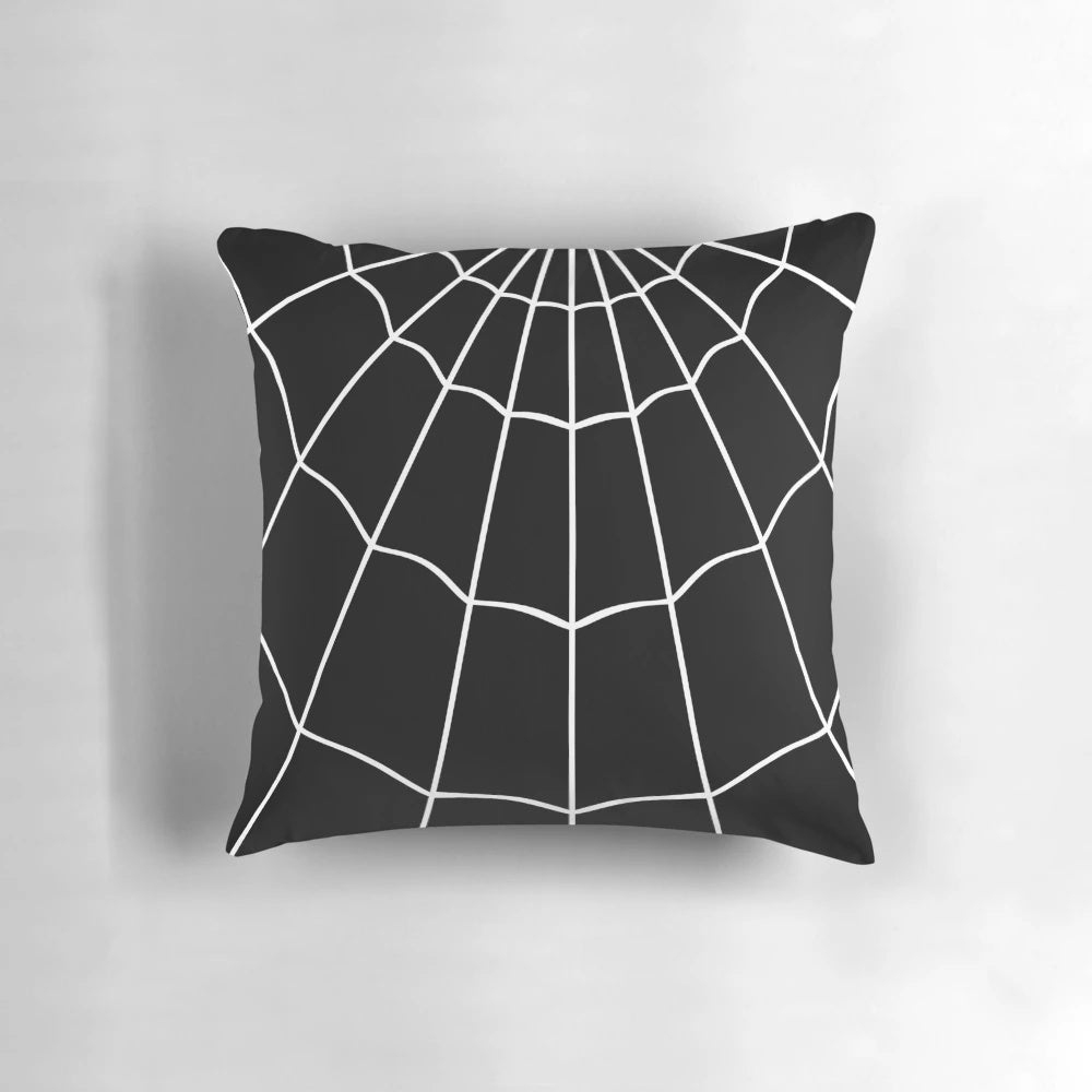 A decorative black and white spider web printed pillow for gothic or Halloween-themed home decor.