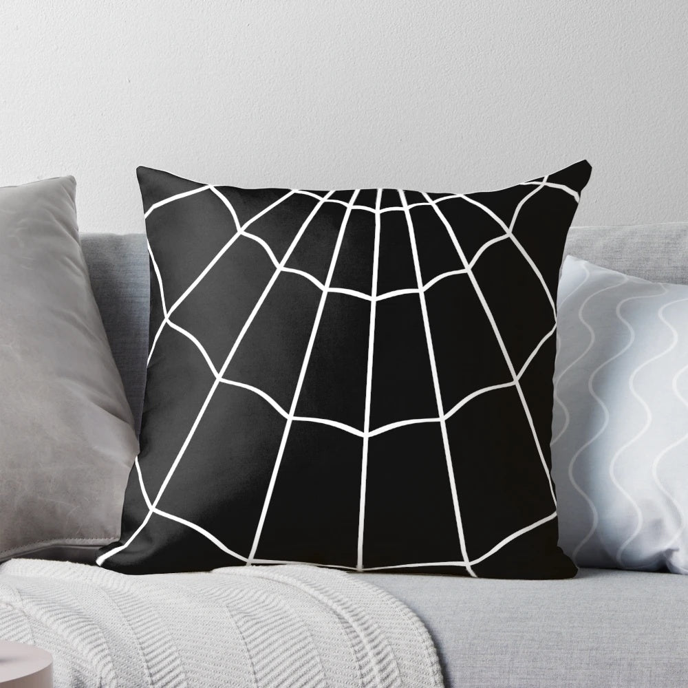 A decorative black and white spider web printed pillow for gothic or Halloween-themed home decor.
