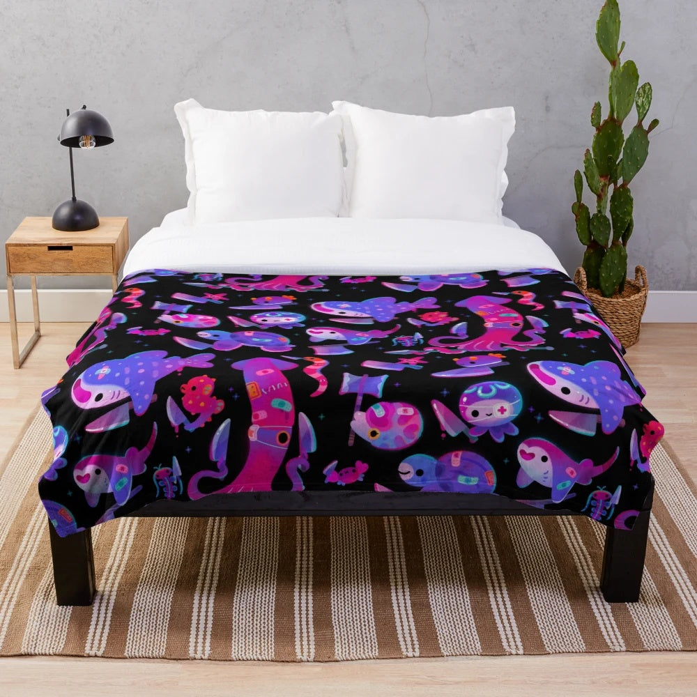 Plush blanket with a variety of spooky and stabby marine life creatures