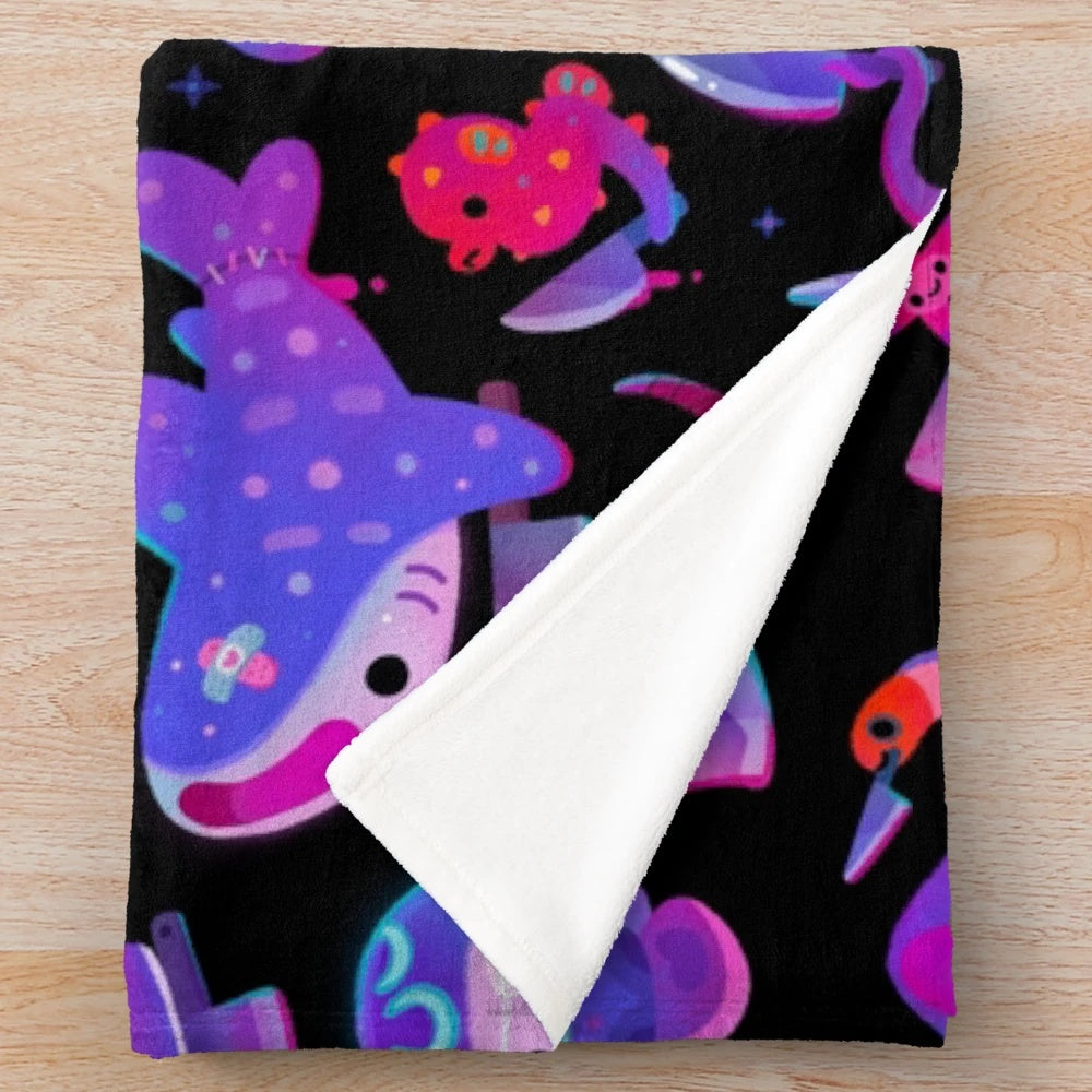 Plush blanket with a variety of spooky and stabby marine life creatures