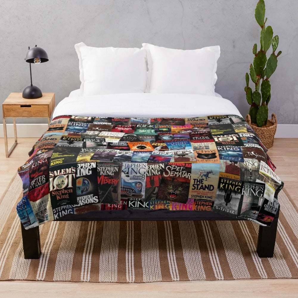 Plush blanket featuring Stephen King book covers for horror book lovers