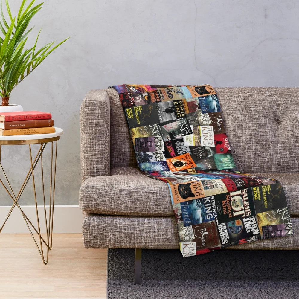 Plush blanket featuring Stephen King book covers for horror book lovers