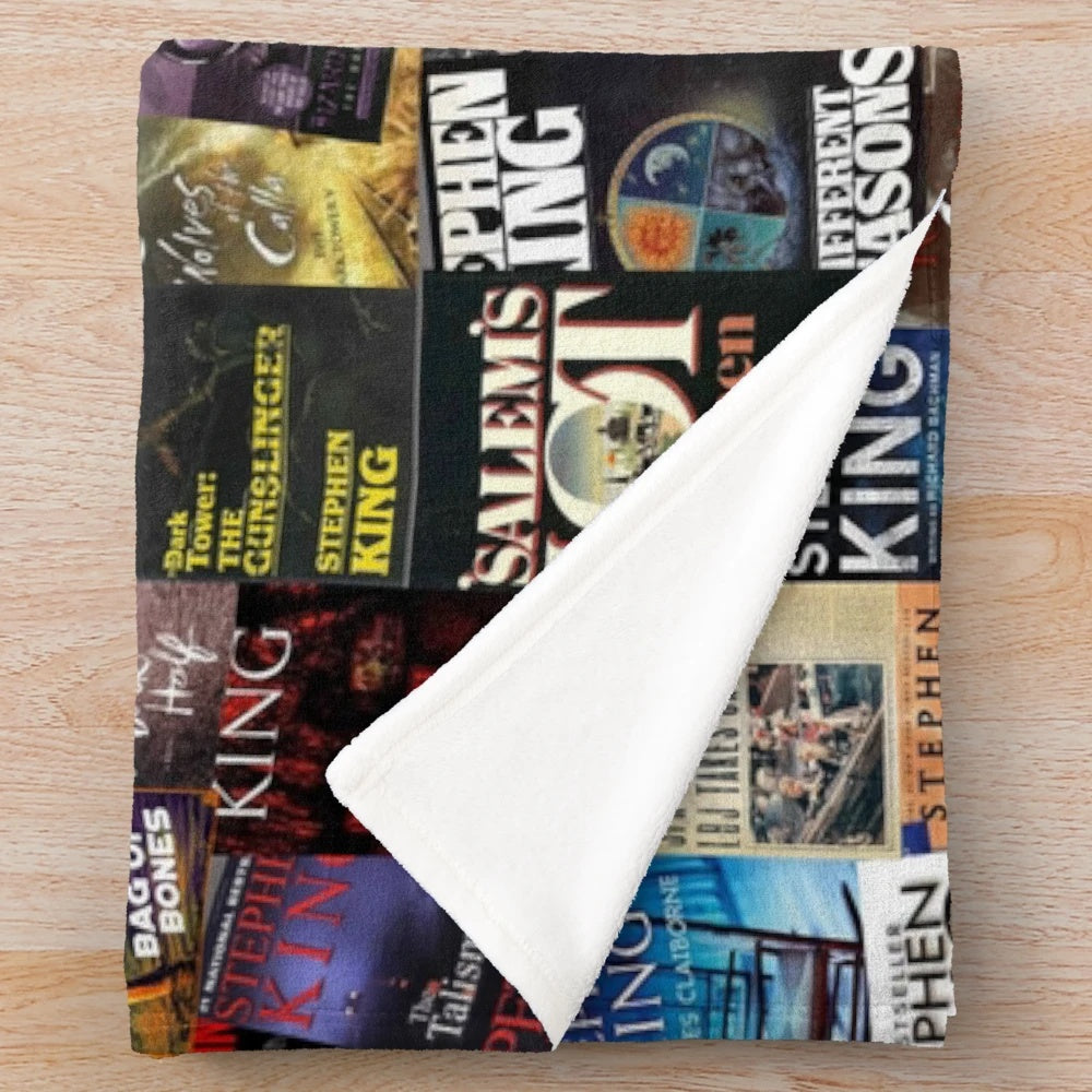 Plush blanket featuring Stephen King book covers for horror book lovers