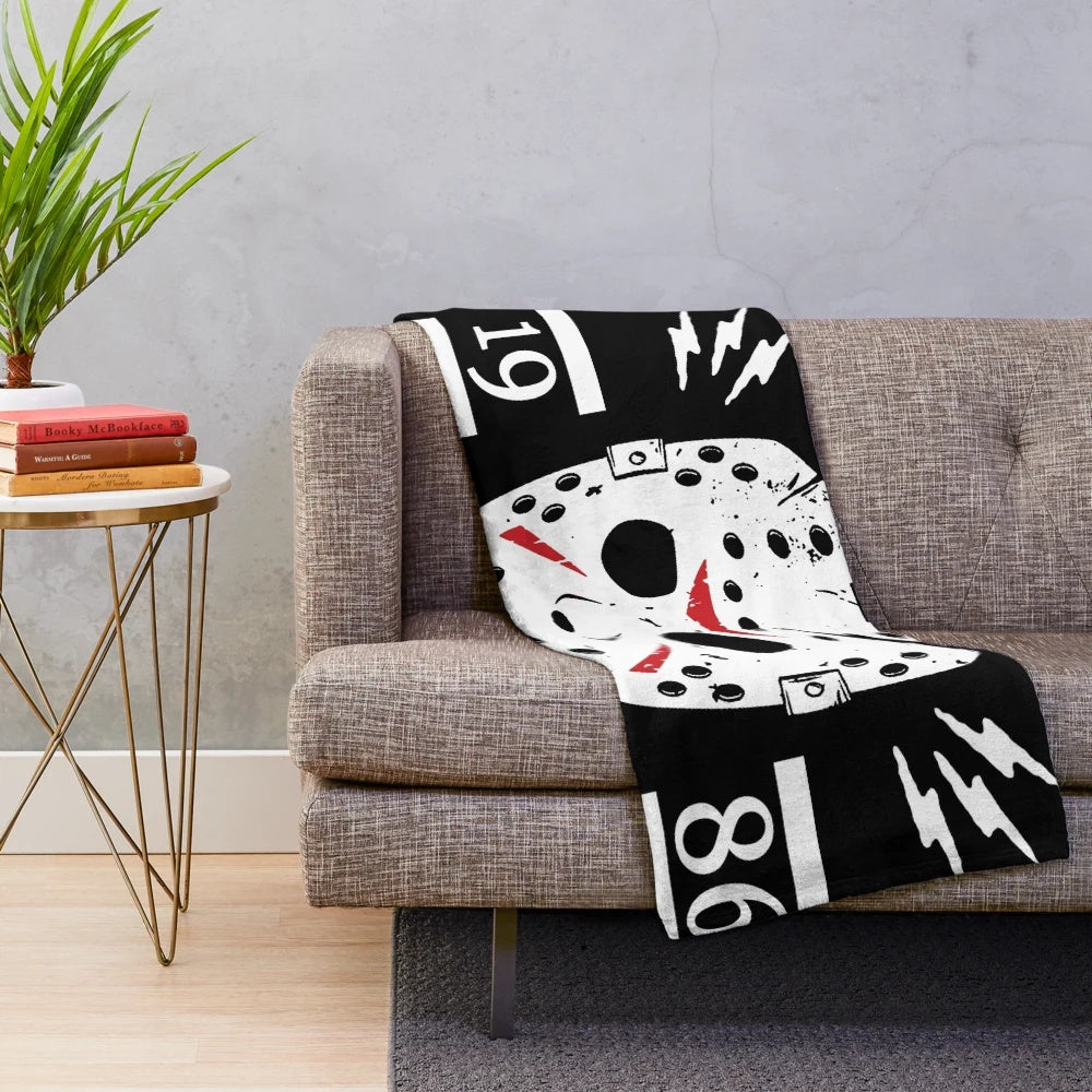 Plush blanket featuring an image of the iconic horror character Jason Voorhees from the Friday the 13th movie series