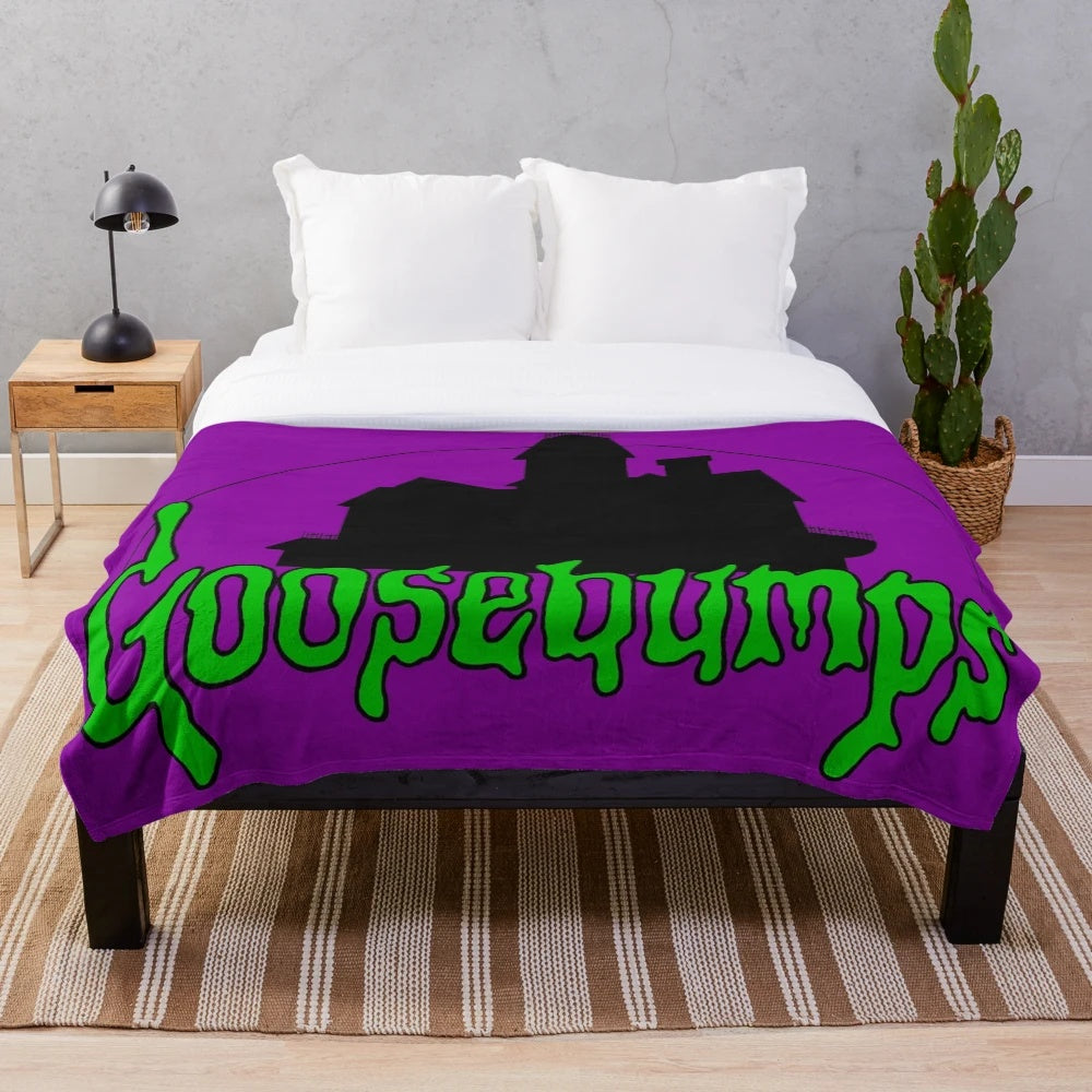 Spooky plush blanket with horror book and movie references