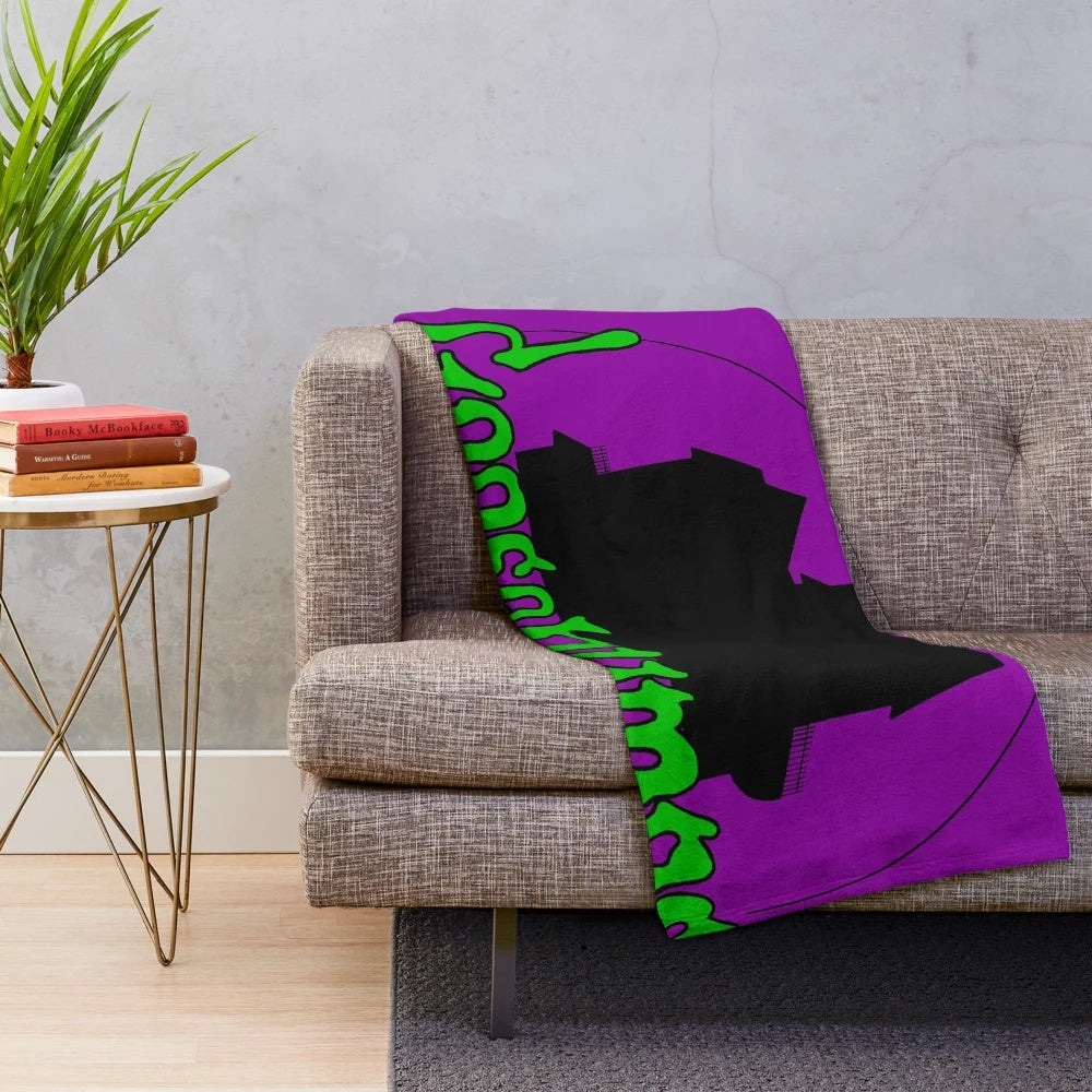 Spooky plush blanket with horror book and movie references