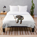 Spooky tribal-inspired plush blanket featuring zuni doll-like design