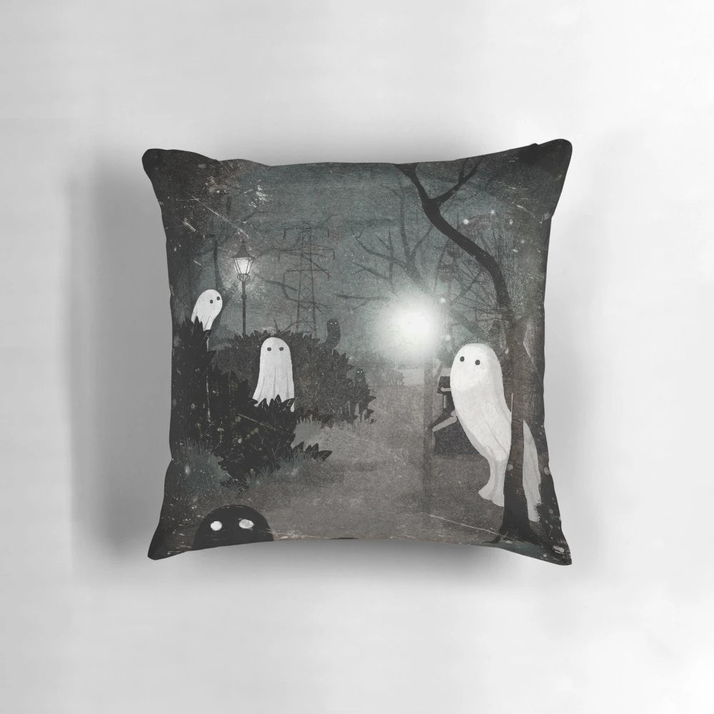Cozy black and white pillow with ghostly silhouettes and a streetlamp