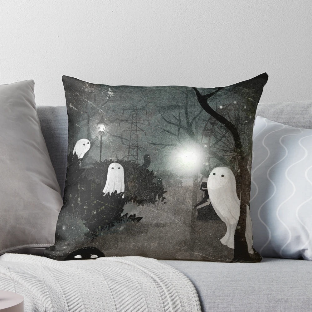 Cozy black and white pillow with ghostly silhouettes and a streetlamp
