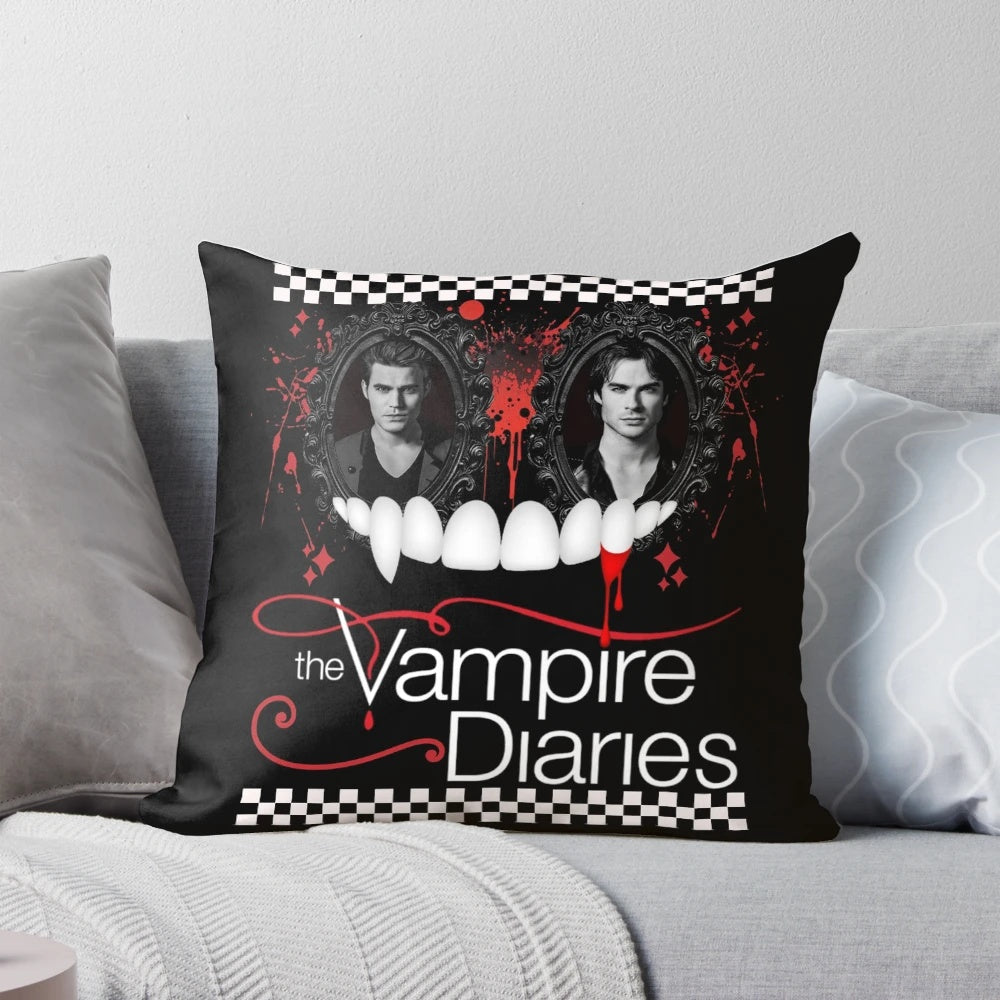 A decorative pillow featuring the iconic characters from the TV series "The Vampire Diaries