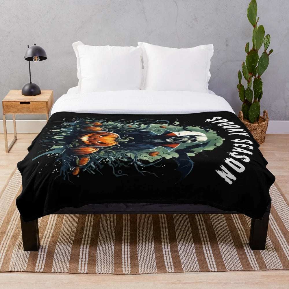 Spooky vampire Halloween plush blanket with bats, skulls, and pumpkins