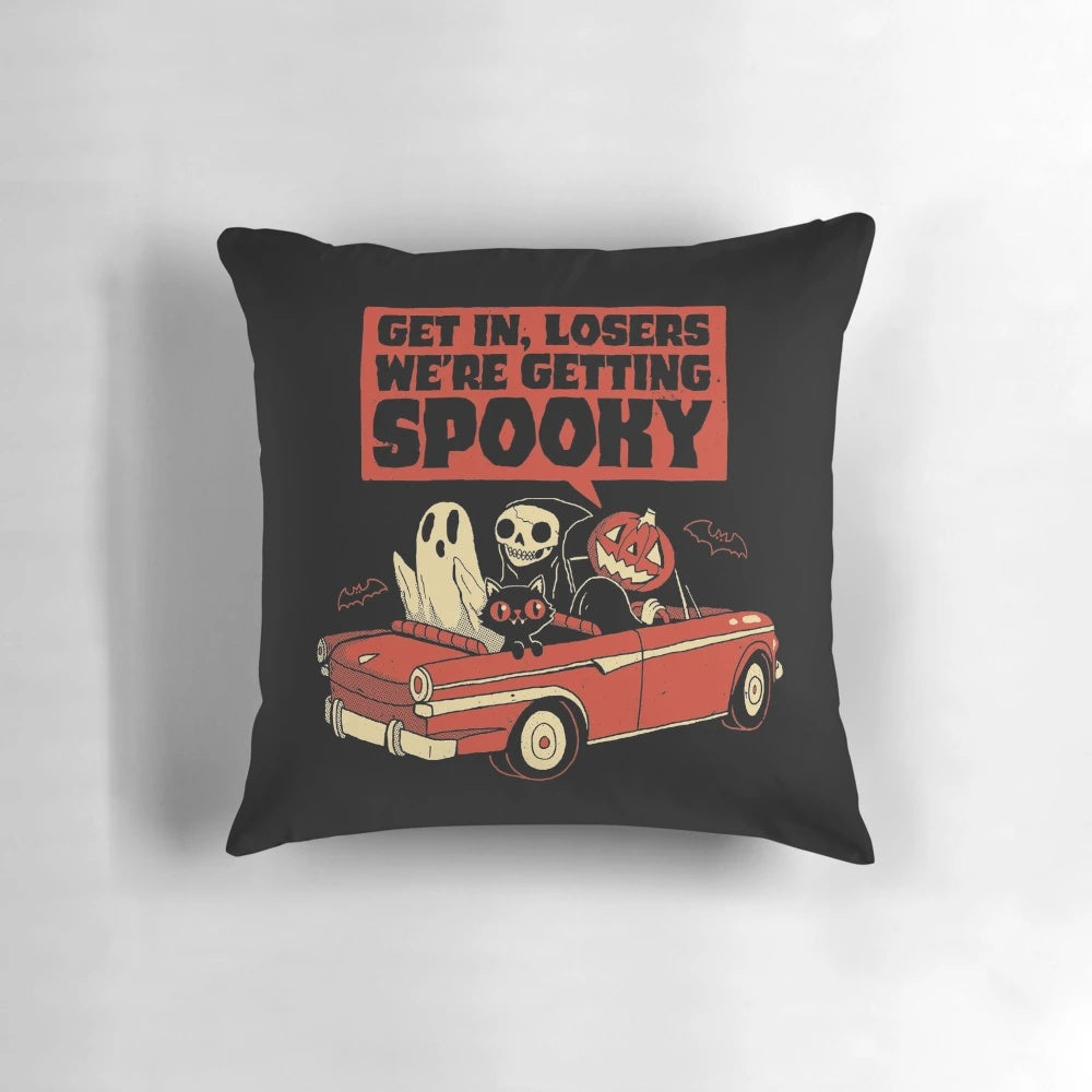 A spooky vintage-style pillow featuring a ghostly pumpkin and black cat design, perfect for Halloween decor.