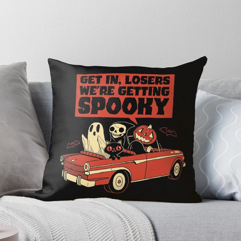 A spooky vintage-style pillow featuring a ghostly pumpkin and black cat design, perfect for Halloween decor.