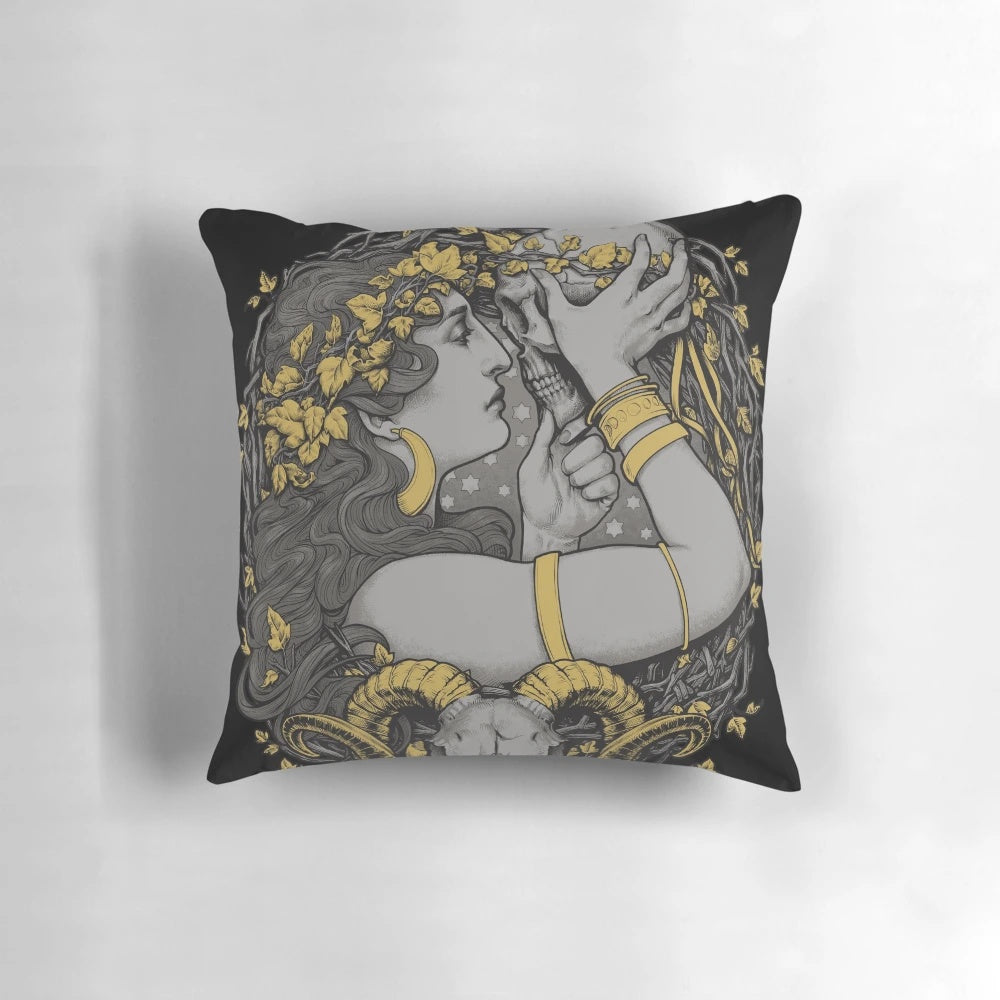 Detailed image of a decorative pillow featuring a gothic illustration of a witch's skull, leaves, and other occult elements.