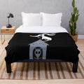 Zero the ghost dog from The Nightmare Before Christmas on a plush blanket