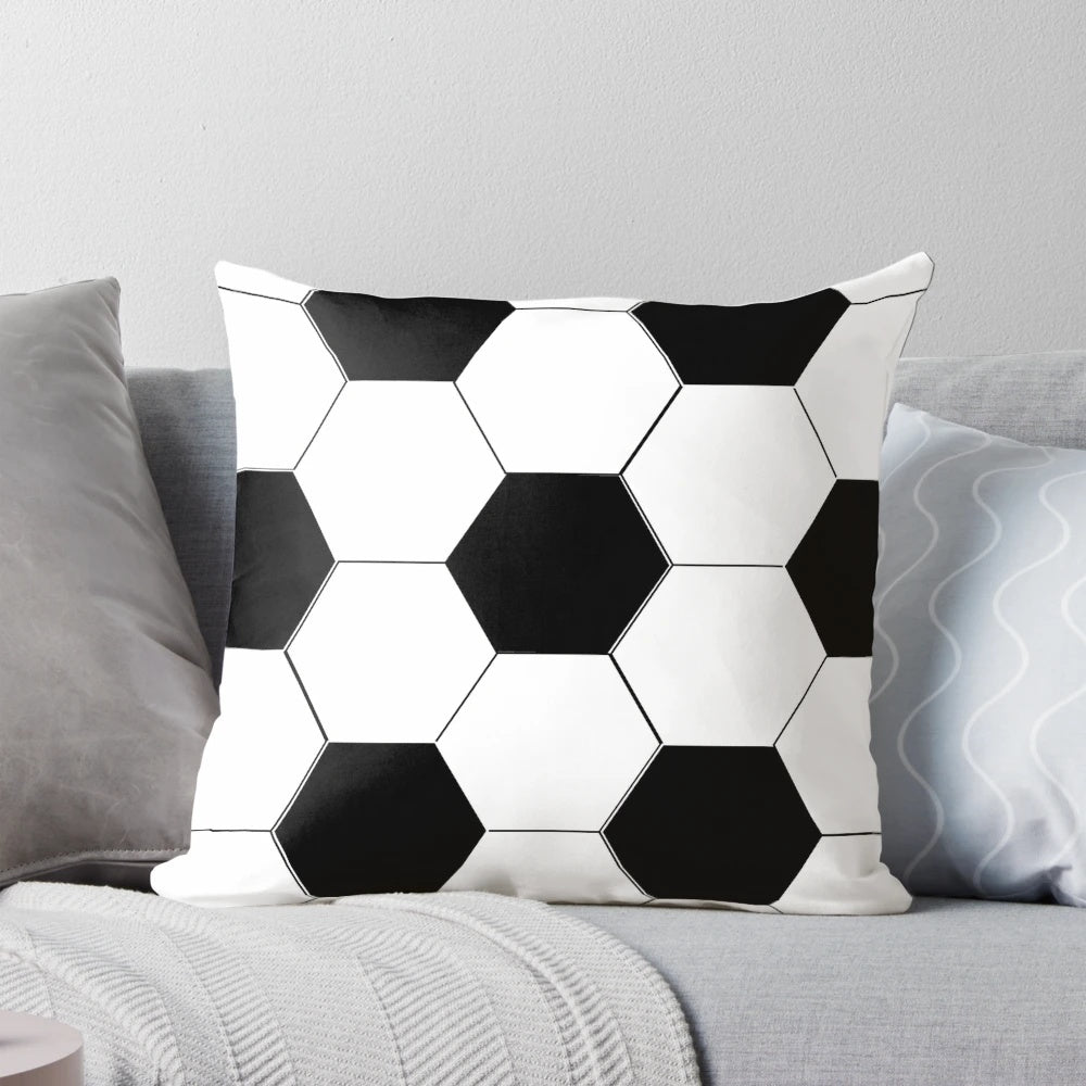 Sports cushion with a black and white soccer ball design, perfect for a man cave or sports fan's home.