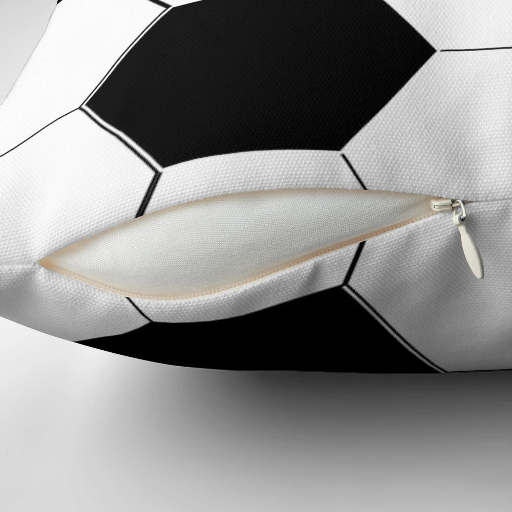 Sports cushion with a black and white soccer ball design, perfect for a man cave or sports fan's home.